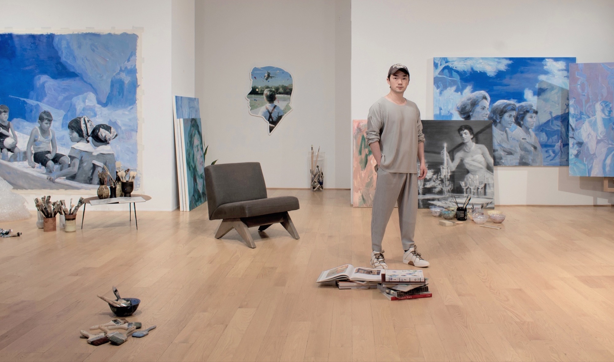 Contemporary artist Vincent Xeus in his studio with Kennedy Women paintings, New York